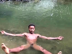 Brown soldier strips naked by the stream