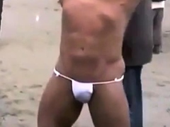 Muscled Asian Stud Bares Almost All At The Beach